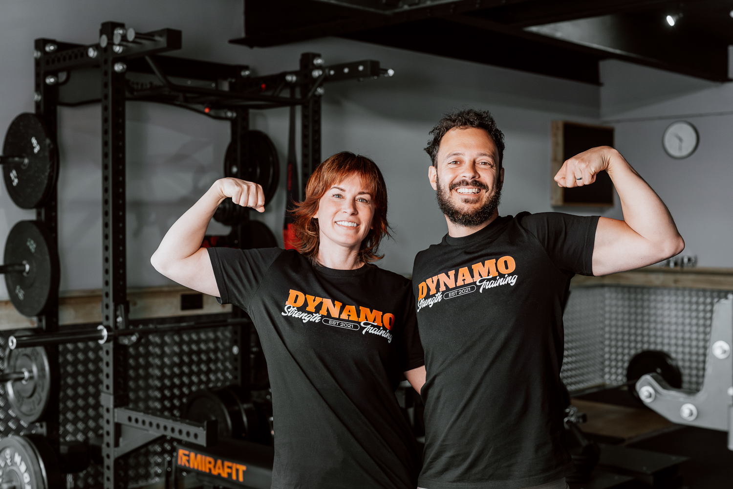 Dynamo Gym founders and community photographed in their strength training space