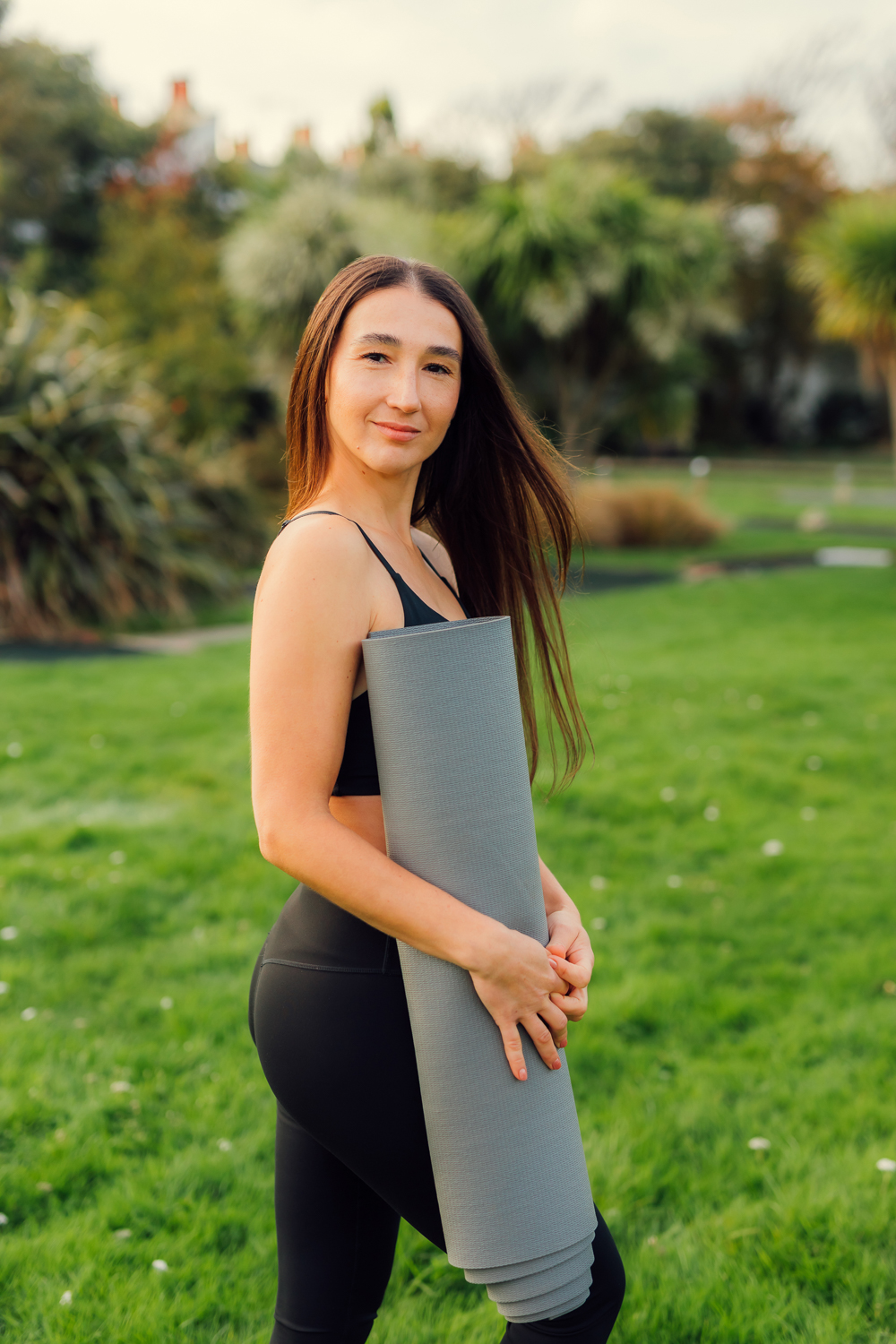 Movement-focused yoga pose by the coast