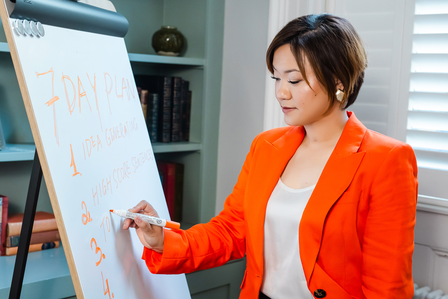 Brand consultant planning content on a whiteboard