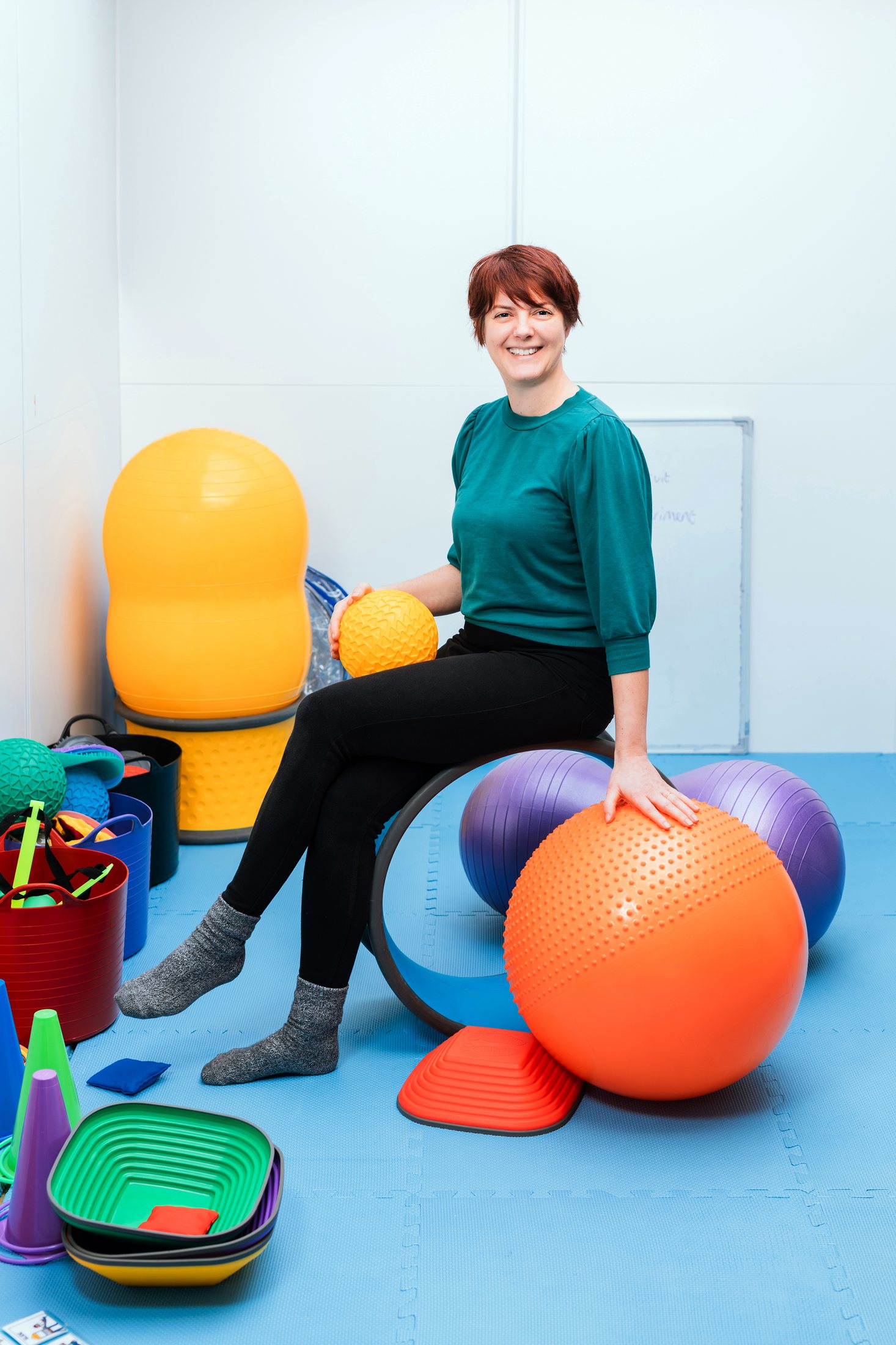 Playful portrait in a colourful studio setting