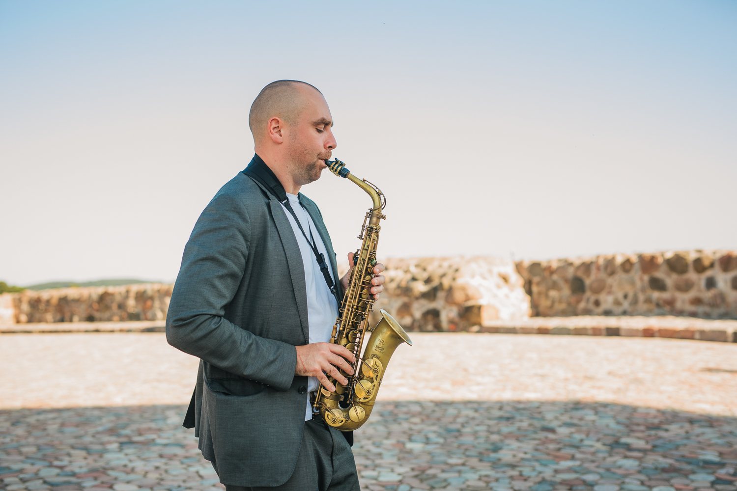 Musician portrait at golden hour by the water