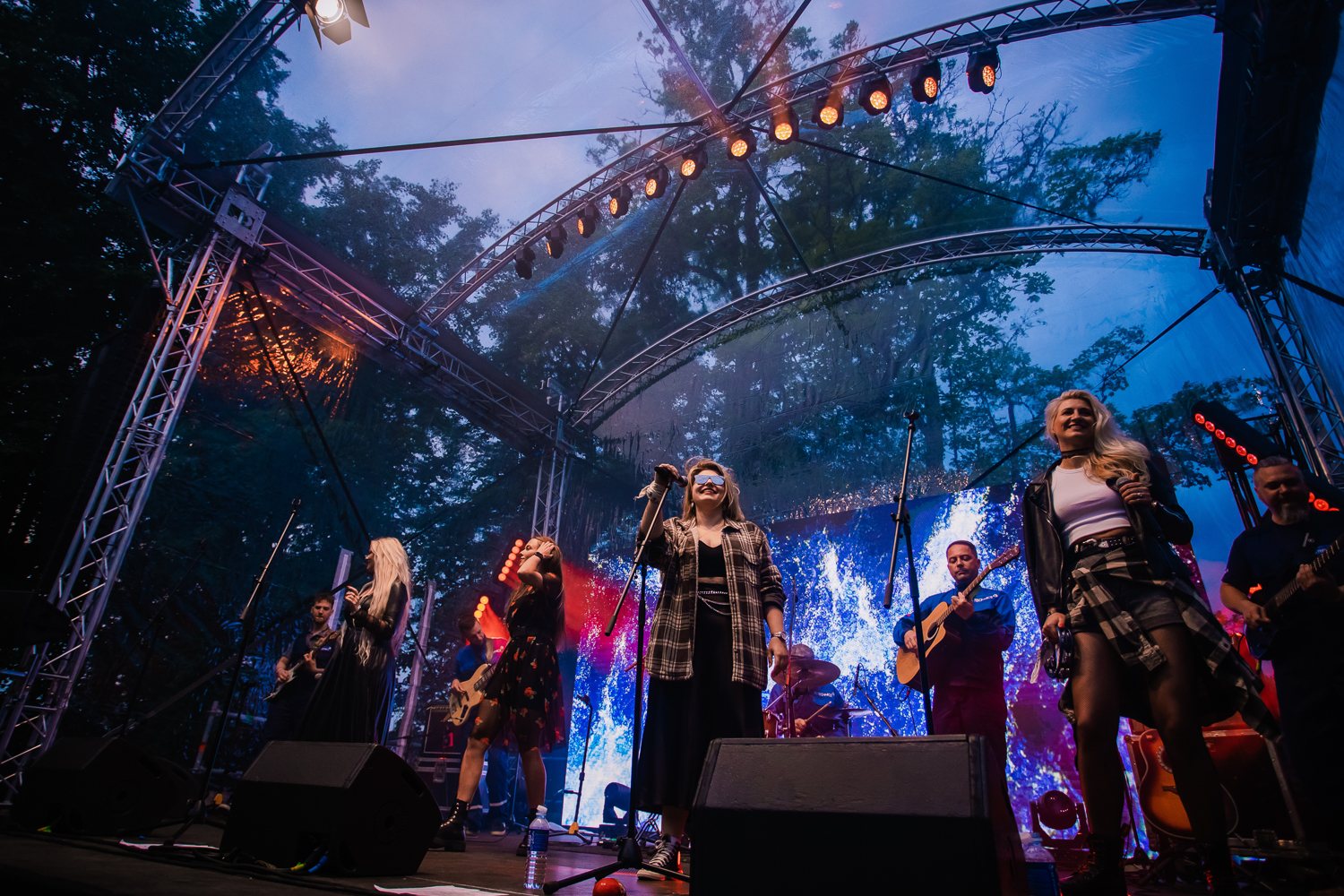 Festival stage performance under dramatic lights