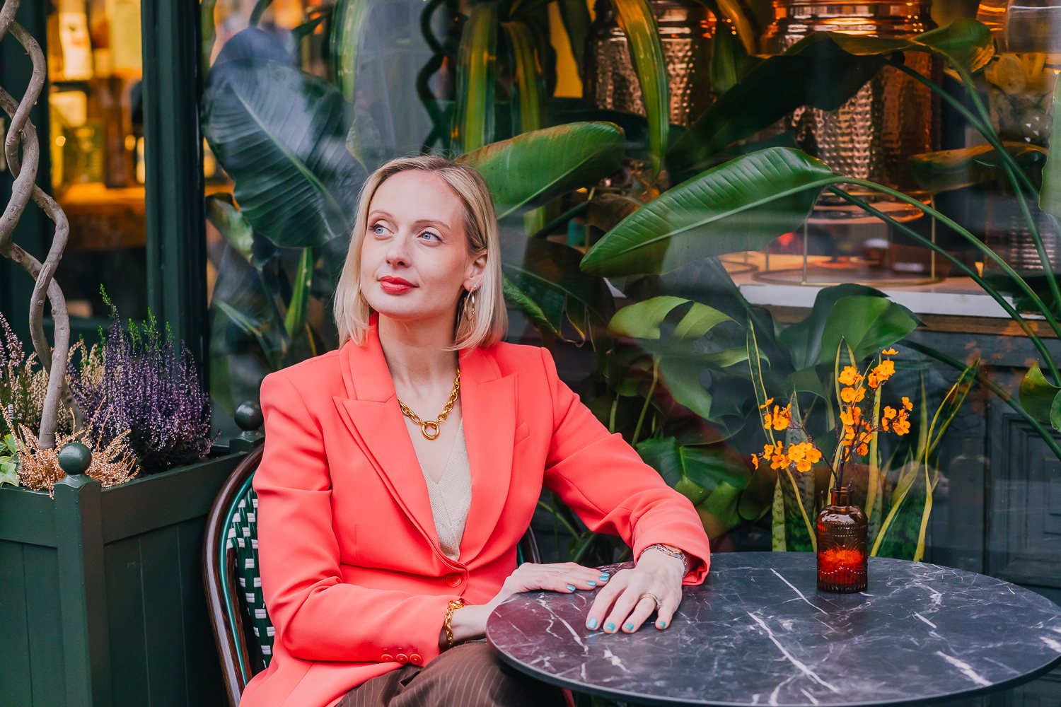Founder portrait in a bold red blazer