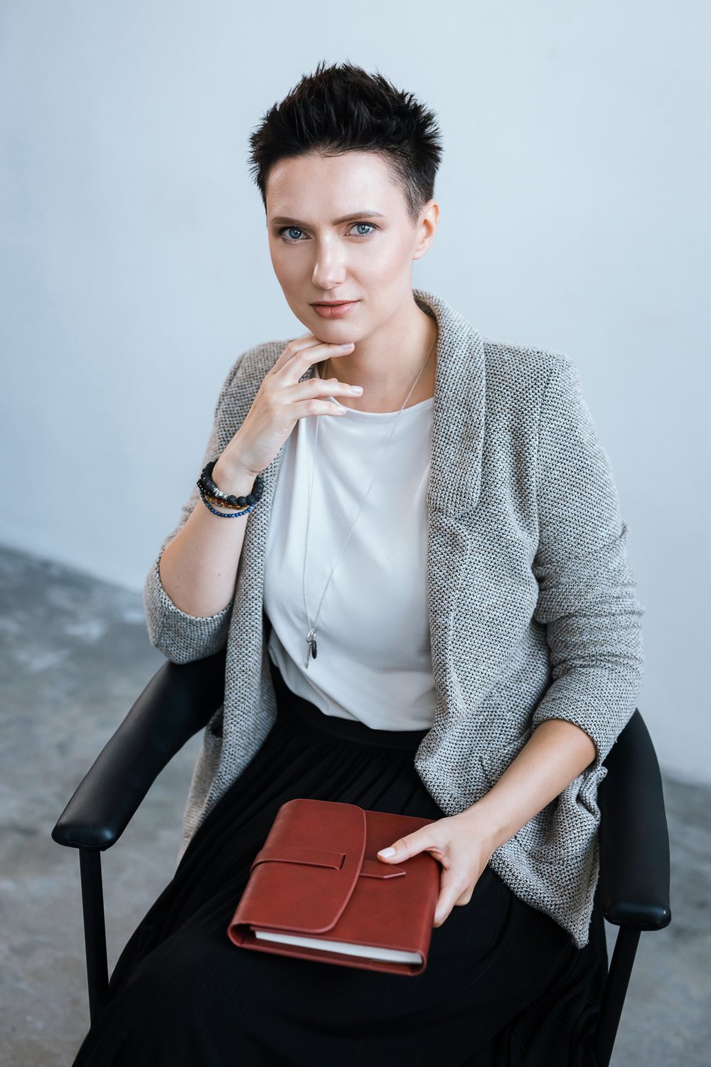 Professional portrait in a soft grey blazer
