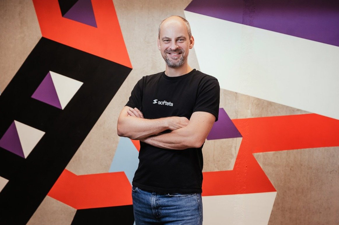 Professional portrait against a graphic studio backdrop