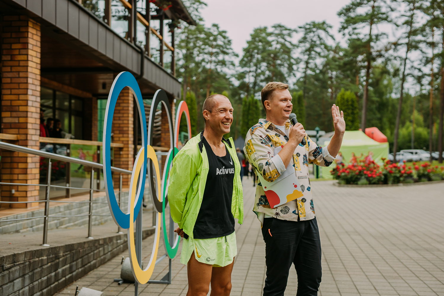 Event hosts speaking at a corporate activation