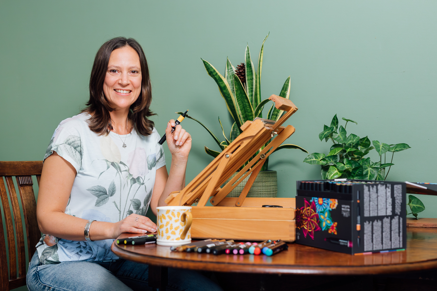 Creative working portrait at a drawing table