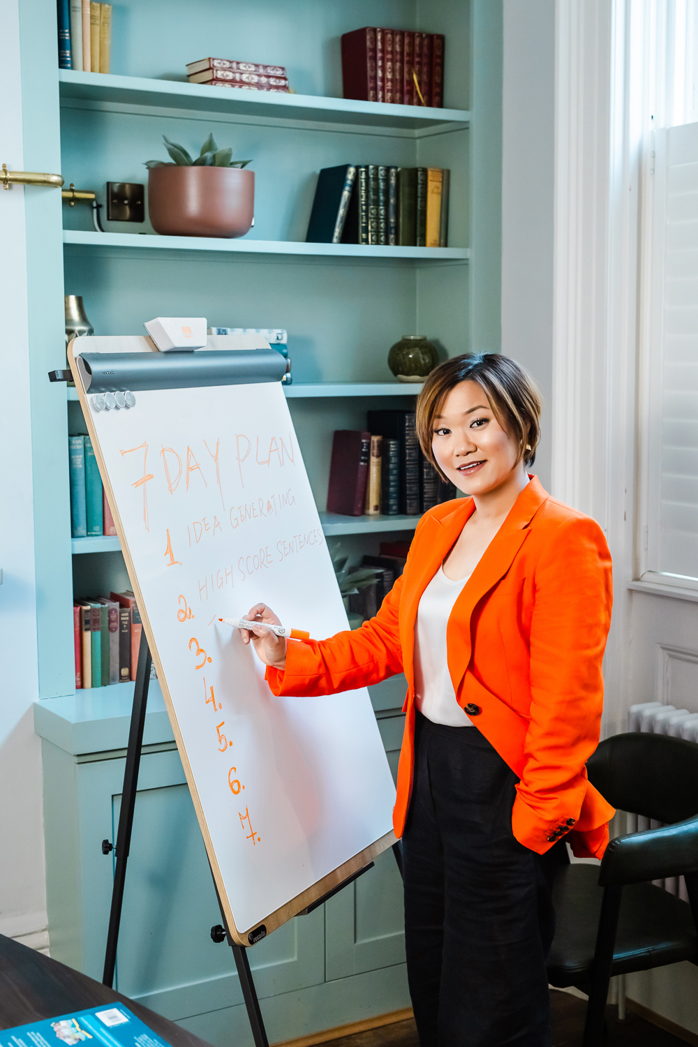 Business coach presenting beside a flip chart