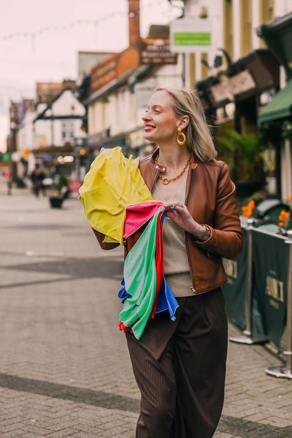 Lifestyle street portrait carrying colour consultation drapes