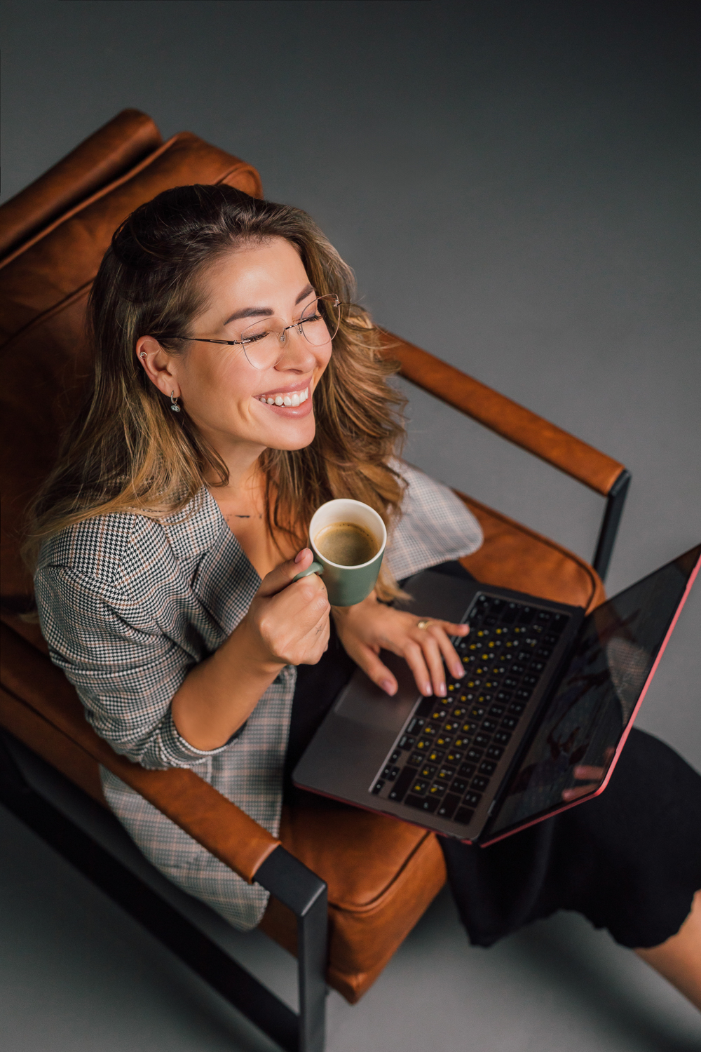 Overhead working portrait with laptop and coffee