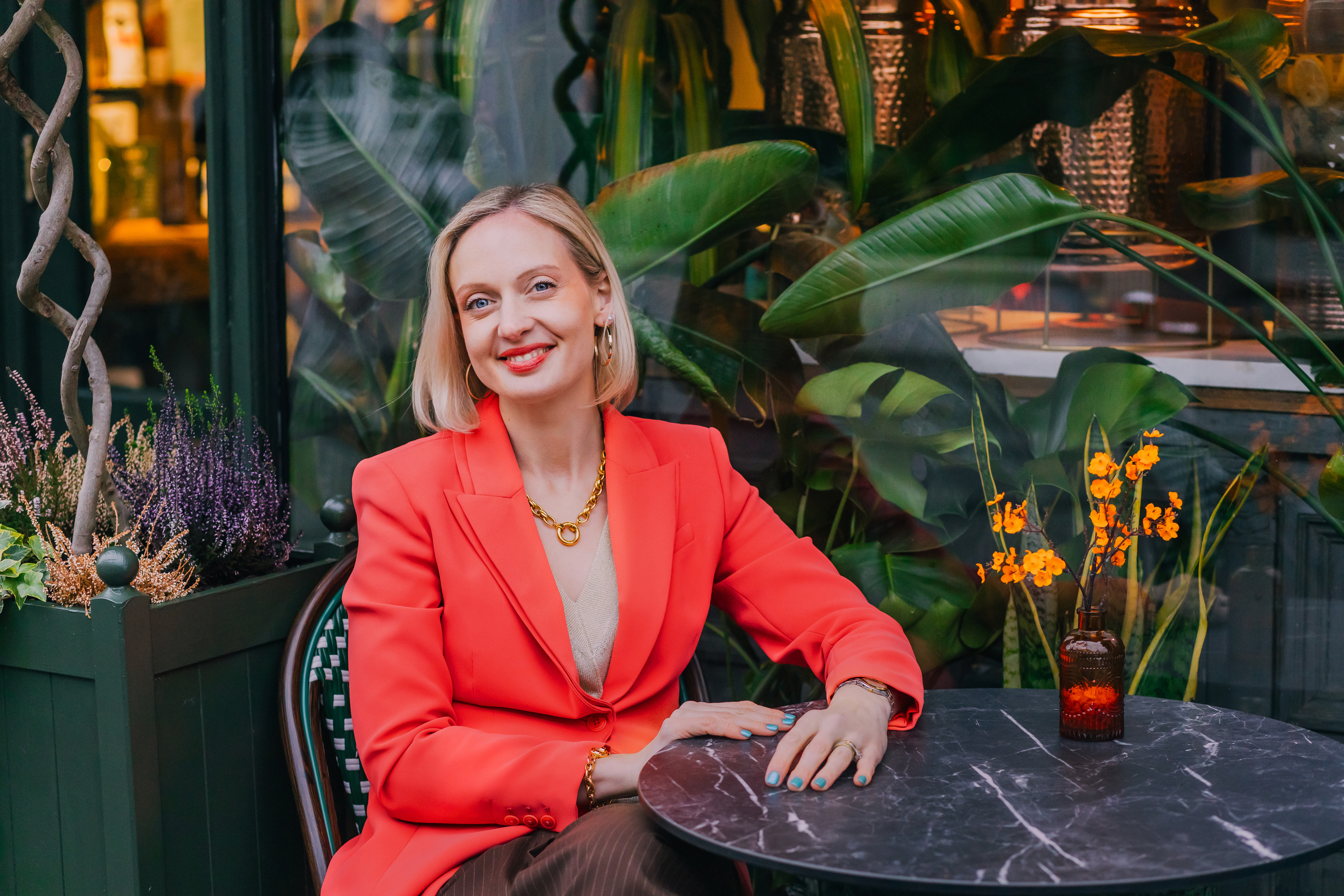 Cafe portrait in a vivid tailored jacket