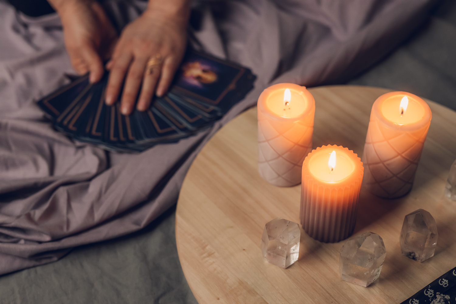 Tarot cards and candles styled on a round table